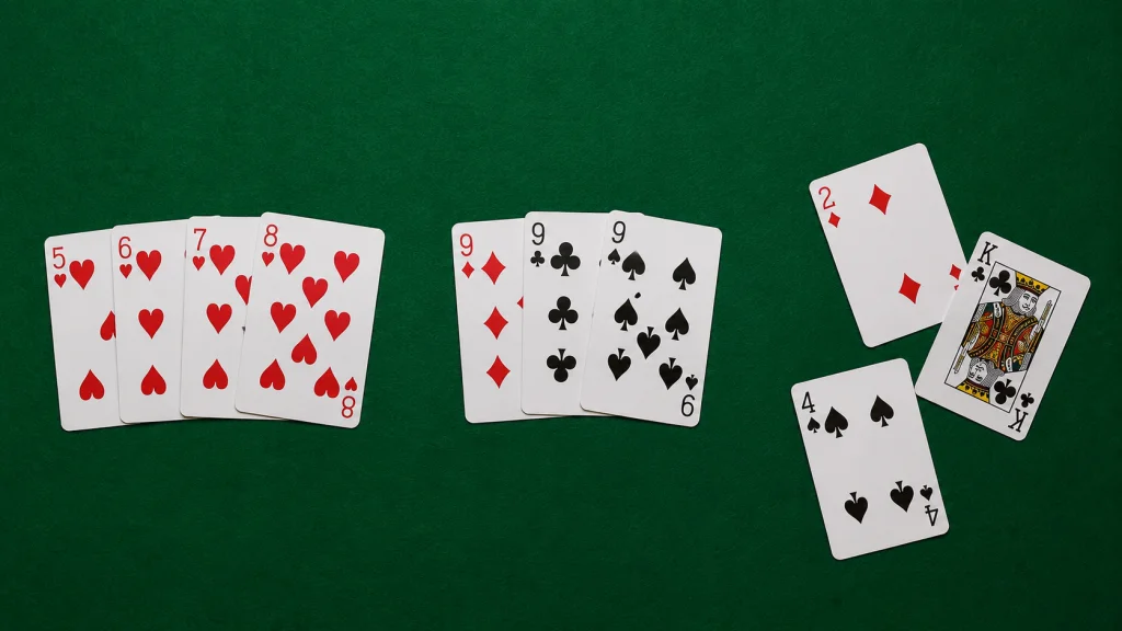 A ten-card hand with a run and a set grouped neatly, and three unrelated deadwood cards set apart